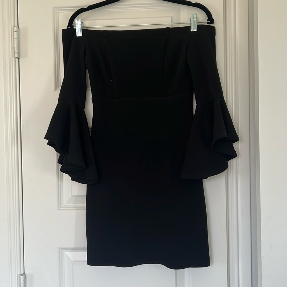 Black off the shoulder mini dress.